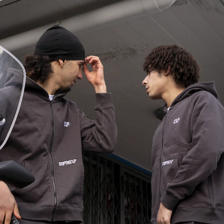 Two models wearing Stars Hoodies outdoors